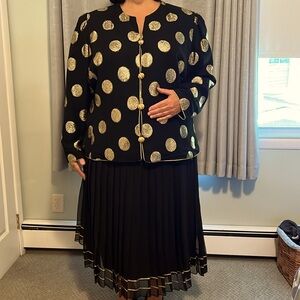 RARE 2 piece Women’s suit Black & Gold Jacket & black pleated lined skirt.